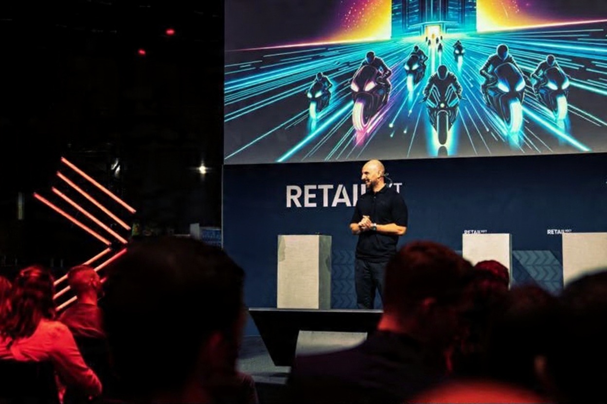 Johnny speaking on stage at RETAIL NXT